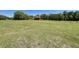 Quaint home on sprawling green lawn with mature trees at 6935 Hickorynut Ln, Ravenel, SC 29470