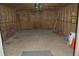 Spacious unfinished garage with exposed beams and concrete floor at 6935 Hickorynut Ln, Ravenel, SC 29470