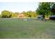 A charming log home sits among green trees and meadows at 6935 Hickorynut Ln, Ravenel, SC 29470