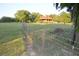 A charming log home surrounded by green trees and a meadow at 6935 Hickorynut Ln, Ravenel, SC 29470