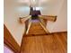 Wooden stairs leading from the main level, featuring wood railings and hardwood flooring at 6935 Hickorynut Ln, Ravenel, SC 29470
