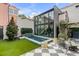 Modern backyard with a pool, patio, and lush greenery creating an outdoor oasis at 70 King St, Charleston, SC 29401