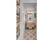 Stylish bathroom featuring a modern vanity with a unique mirror and decorative artwork at 70 King St, Charleston, SC 29401
