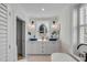 Bright bathroom showcasing dual vanities, modern lighting, and a patterned tile floor at 70 King St, Charleston, SC 29401