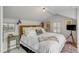 Bright bedroom with a plush white bed, unique artwork, and a cozy, inviting atmosphere at 70 King St, Charleston, SC 29401