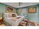 Comfortable bedroom featuring unique decor, plush bedding, and ample natural light at 70 King St, Charleston, SC 29401