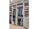 Well-organized closet featuring built-in shelving, hanging rods, and ample storage space at 70 King St, Charleston, SC 29401