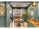 An elegant dining area features custom cabinetry with wood countertops and sight lines into the dining room at 70 King St, Charleston, SC 29401