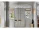 Elegant entryway featuring a detailed arched transom window and a classic paneled door at 70 King St, Charleston, SC 29401