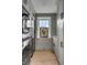 Well-lit laundry room with sleek, front-load washer and dryer, ample storage, and stylish decor at 70 King St, Charleston, SC 29401