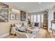 Bright living room with eclectic decor, including a stylish sofa and unique wall art at 70 King St, Charleston, SC 29401
