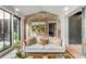 Stylish living room featuring a brick accent wall and a view to the outside at 70 King St, Charleston, SC 29401