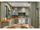 Updated prep kitchen with vintage-style appliances, open shelving, and custom cabinetry at 70 King St, Charleston, SC 29401