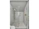 Modern shower with white subway tiles, a glass enclosure, and stylish gold fixtures at 70 King St, Charleston, SC 29401