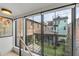 Bright, airy bedroom with large windows overlooking the backyard and surrounding buildings at 70 King St, Charleston, SC 29401