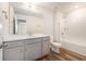 Bright bathroom with a single sink vanity and tub shower combo at 715 Mcroy St, Moncks Corner, SC 29461