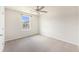 Bright bedroom with neutral carpet and walls, ceiling fan, and a sunny window at 715 Mcroy St, Moncks Corner, SC 29461