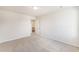 Bedroom with neutral carpet, door and open door to ensuite bathroom at 715 Mcroy St, Moncks Corner, SC 29461
