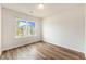 Cozy bedroom featuring beautiful hardwood floors and a bright window offering natural light at 715 Mcroy St, Moncks Corner, SC 29461