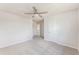 Bedroom featuring neutral carpet, ceiling fan, and entry to hallway with doors at 715 Mcroy St, Moncks Corner, SC 29461