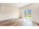 Bright dining room with wood floors, a chandelier, and sliding glass doors to the patio at 715 Mcroy St, Moncks Corner, SC 29461