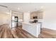 Modern kitchen features stainless appliances, gray cabinets, an island, and hardwood flooring at 715 Mcroy St, Moncks Corner, SC 29461