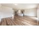 Spacious living room showcasing hardwood flooring and an open layout leading to the kitchen at 715 Mcroy St, Moncks Corner, SC 29461