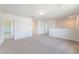 Second story loft with neutral carpet, natural light, and open doorways at 715 Mcroy St, Moncks Corner, SC 29461