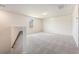 Upstairs loft with neutral carpet, natural light, and a stairway with a handrail at 715 Mcroy St, Moncks Corner, SC 29461