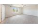 Large main bedroom with carpet flooring, ceiling fan, and natural light from two large windows at 715 Mcroy St, Moncks Corner, SC 29461