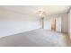 Spacious main bedroom with carpet flooring, ceiling fan, and multiple doorways at 715 Mcroy St, Moncks Corner, SC 29461