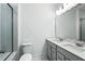 Well-lit bathroom featuring a double sink vanity and a glass-enclosed shower at 816 Gentle Breeze Dr, Summerville, SC 29486