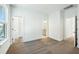 A carpeted bedroom with multiple doorways showcasing the home's layout at 816 Gentle Breeze Dr, Summerville, SC 29486