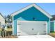 The detached garage has a blue exterior with a white garage door and black accents at 816 Gentle Breeze Dr, Summerville, SC 29486