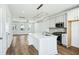 Bright, modern kitchen with stainless steel appliances, white cabinetry, and a large center island at 816 Gentle Breeze Dr, Summerville, SC 29486
