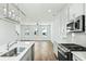 Modern kitchen featuring white cabinets, a stainless steel oven, and an island with sink at 816 Gentle Breeze Dr, Summerville, SC 29486