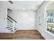 Spacious living area with hardwood floors, a staircase, a front door, and natural light at 816 Gentle Breeze Dr, Summerville, SC 29486