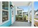Covered front porch featuring white columns, open views of the community, and a concrete floor at 816 Gentle Breeze Dr, Summerville, SC 29486