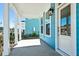 Inviting covered front porch with white columns offering neighborhood views of the street at 816 Gentle Breeze Dr, Summerville, SC 29486