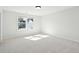 Bright bedroom features large window, neutral walls, carpet, and a ceiling light at 825 Alma Square Dr, Moncks Corner, SC 29461