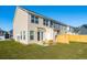 Townhome backyard with patio seating and privacy fence, offering outdoor living space at 827 Alma Square Dr, Moncks Corner, SC 29461