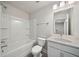 Bright bathroom featuring a shower over tub, white vanity, and a neutrally painted walls at 827 Alma Square Dr, Moncks Corner, SC 29461