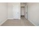 Bedroom with neutral carpeting and baseboards leading to another room at 827 Alma Square Dr, Moncks Corner, SC 29461