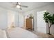 Bedroom featuring neutral decor, with closet and bathroom entries, and a potted plant in the corner at 827 Alma Square Dr, Moncks Corner, SC 29461