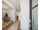 Inviting entryway with hardwood floors, stylish rug, and views into the adjacent dining area and kitchen spaces at 827 Alma Square Dr, Moncks Corner, SC 29461