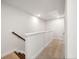 Upstairs hallway with neutral carpeting, white walls and trim leading to bedrooms, bathroom, or storage at 827 Alma Square Dr, Moncks Corner, SC 29461