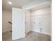 Laundry room featuring tiled floors, utility hookups, and wire shelving at 827 Alma Square Dr, Moncks Corner, SC 29461