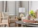 Cozy seating area with a stylish wooden chair, soft pillows, and ample natural light from the window at 827 Alma Square Dr, Moncks Corner, SC 29461