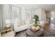 Bright living room featuring a comfortable white sofa and stylish decor, with lots of natural light at 827 Alma Square Dr, Moncks Corner, SC 29461