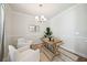 Cozy office space with neutral decor, a wooden desk, two chairs, and stylish accents, perfect for remote work at 827 Alma Square Dr, Moncks Corner, SC 29461